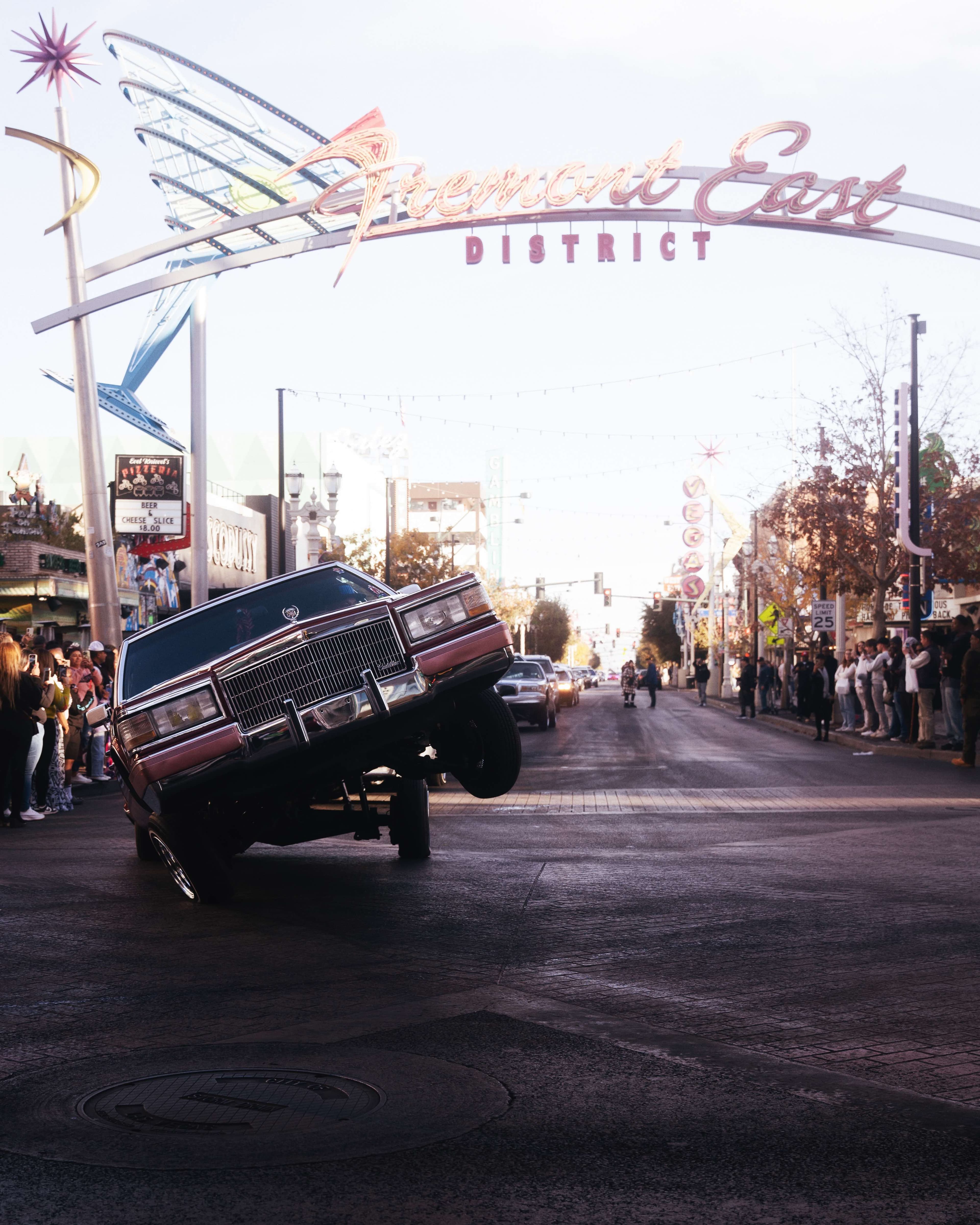 Hydraulic lowrider competition under the famous Fremont East neon sign in Las Vegas