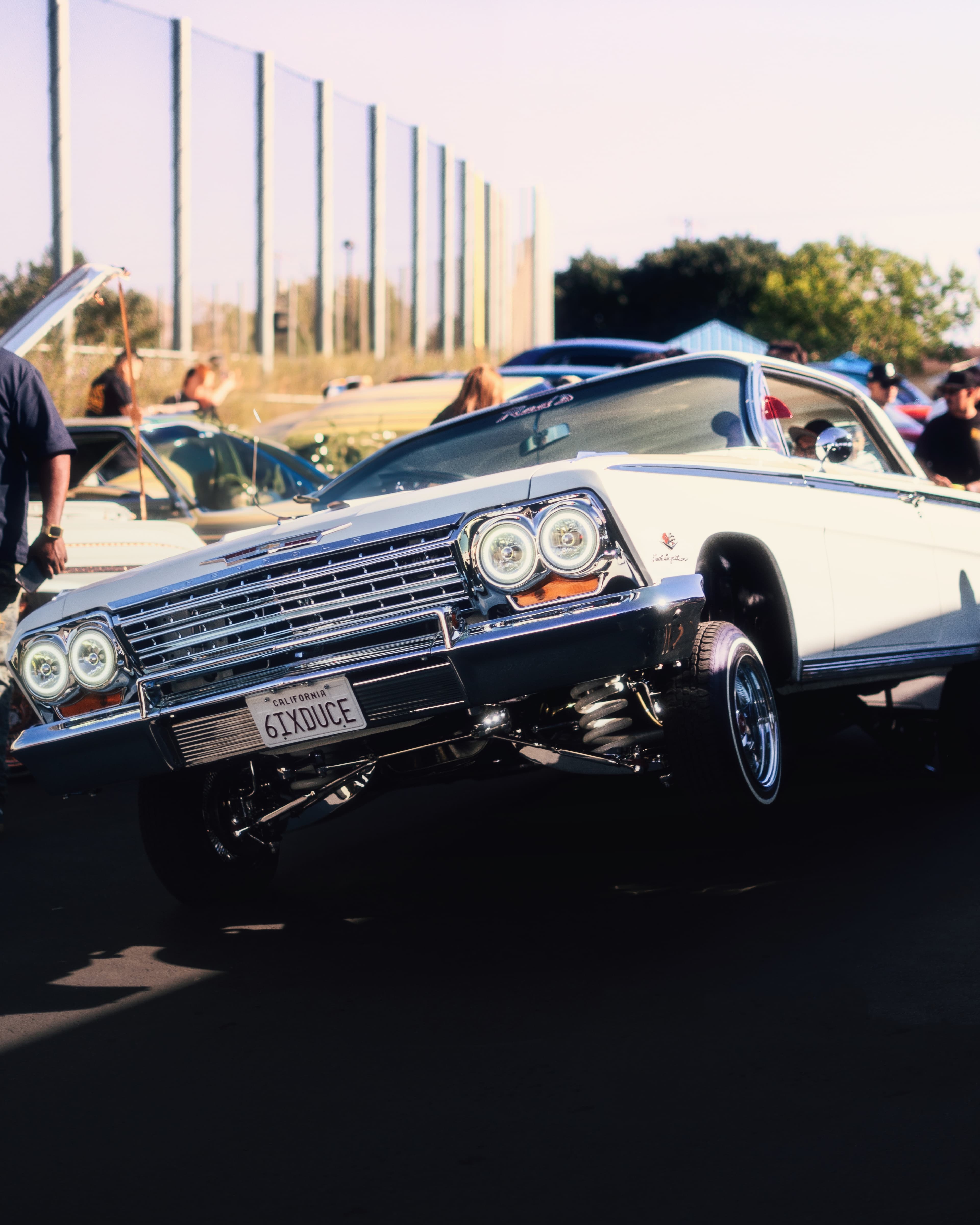 White Chevrolet Impala front view at golden hour